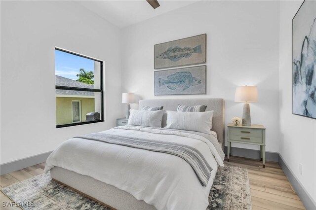 bedroom featuring wood-type flooring and ceiling fan