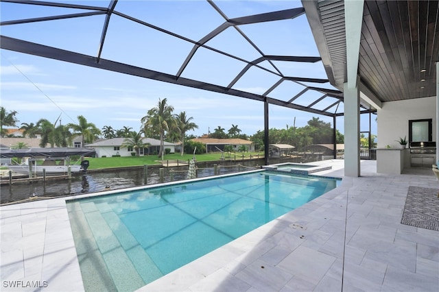 view of pool with a lanai, a patio area, a water view, area for grilling, and an in ground hot tub