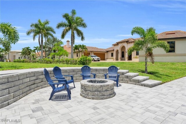 view of patio / terrace featuring an outdoor fire pit