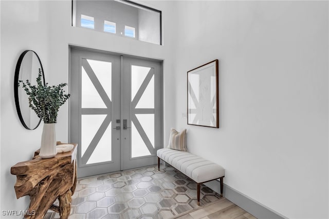 entryway featuring french doors and a healthy amount of sunlight