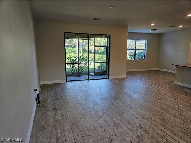 spare room featuring dark hardwood / wood-style floors