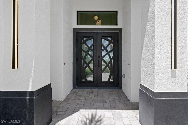 doorway to property featuring french doors