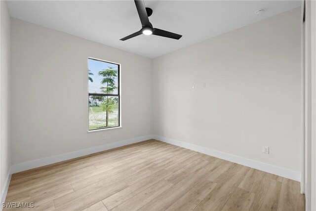 spare room featuring ceiling fan and light hardwood / wood-style flooring