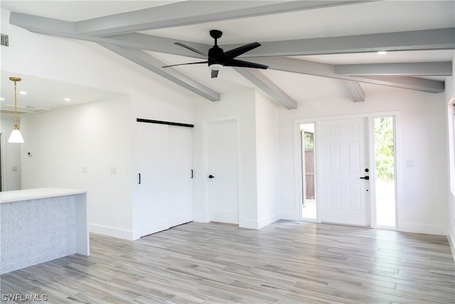 foyer entrance with vaulted ceiling with beams, ceiling fan, and light wood-type flooring