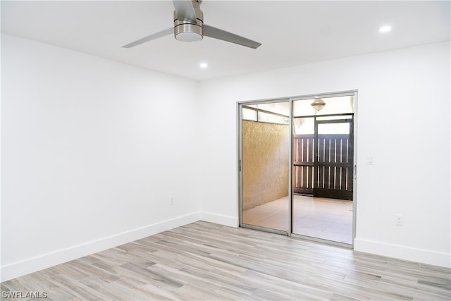 spare room with light hardwood / wood-style floors and ceiling fan