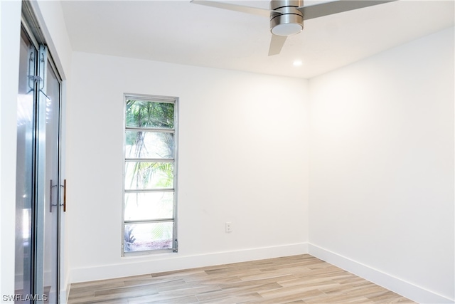 empty room with light hardwood / wood-style floors and ceiling fan