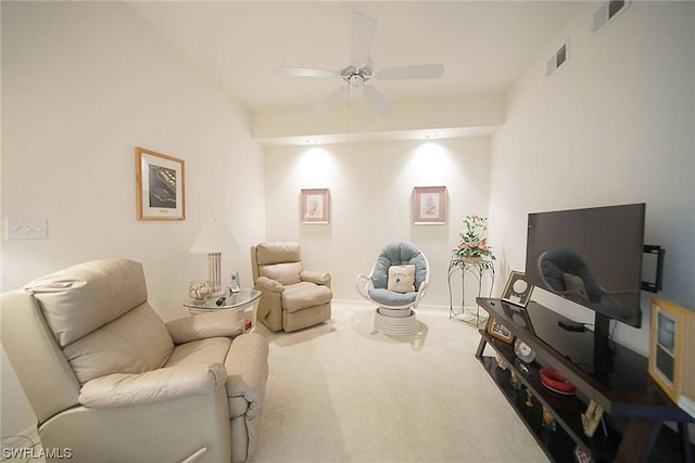 living room featuring ceiling fan and carpet