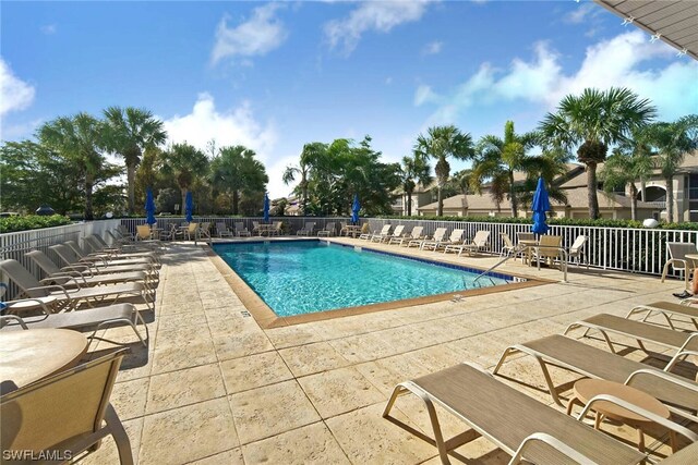 view of swimming pool featuring a patio area