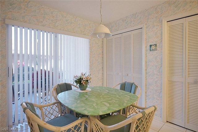 dining space with light tile floors