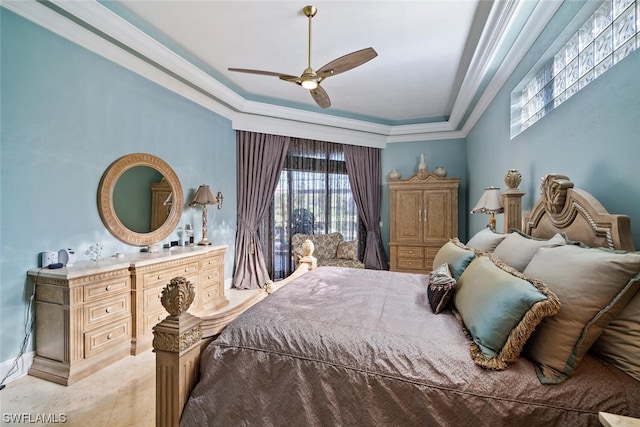 bedroom featuring crown molding, light tile floors, ceiling fan, and a tray ceiling