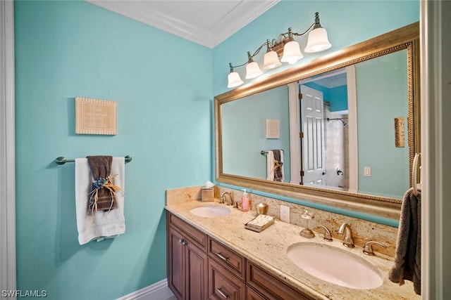 bathroom featuring crown molding and dual bowl vanity