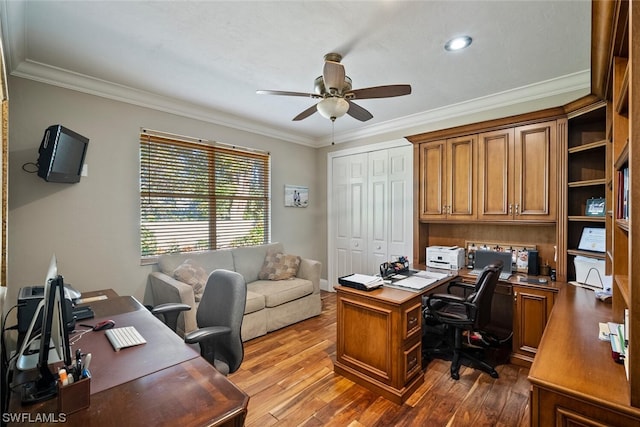 home office featuring hardwood / wood-style floors, ceiling fan, and crown molding