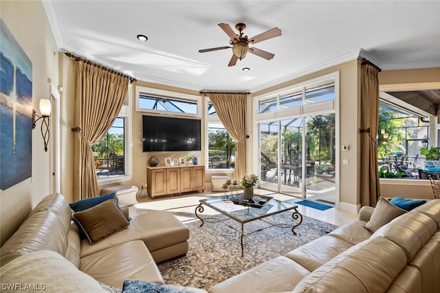 living room with crown molding, plenty of natural light, and ceiling fan