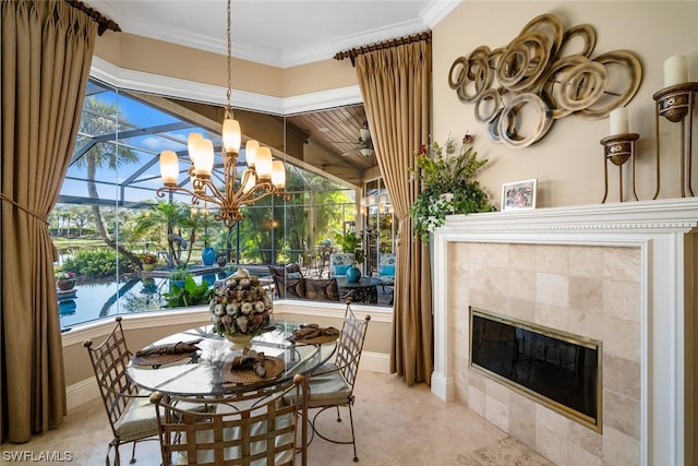 tiled dining area featuring a tile fireplace, ornamental molding, and a notable chandelier