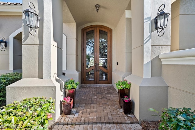 property entrance featuring french doors