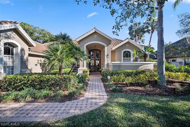 mediterranean / spanish home with french doors