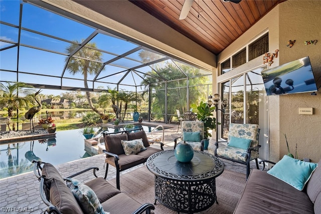 sunroom / solarium with wood ceiling and ceiling fan