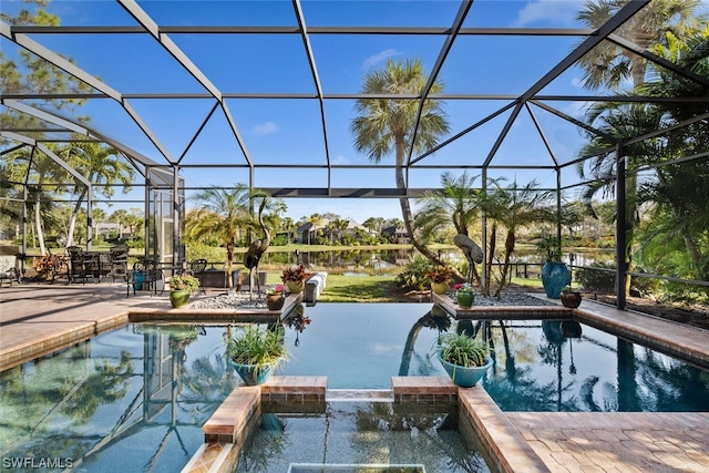 view of pool with an in ground hot tub, glass enclosure, and a patio