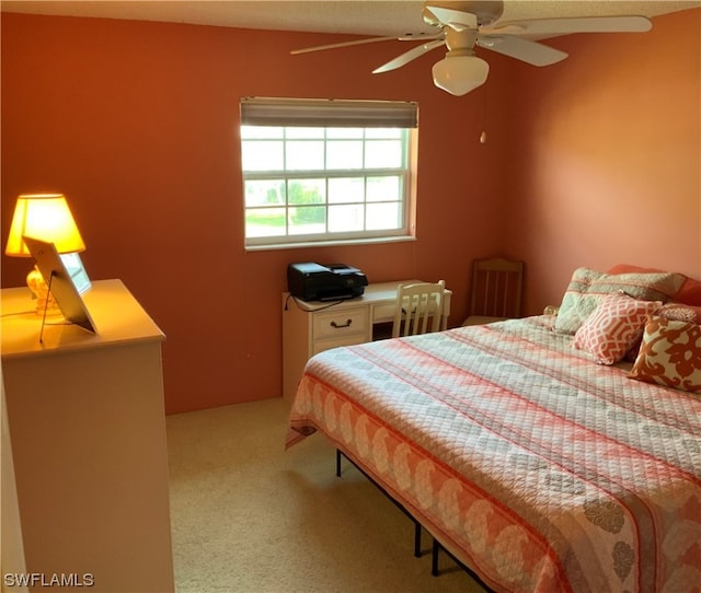 bedroom with light carpet and ceiling fan