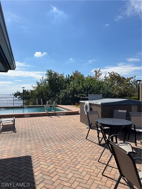 view of patio featuring a community pool