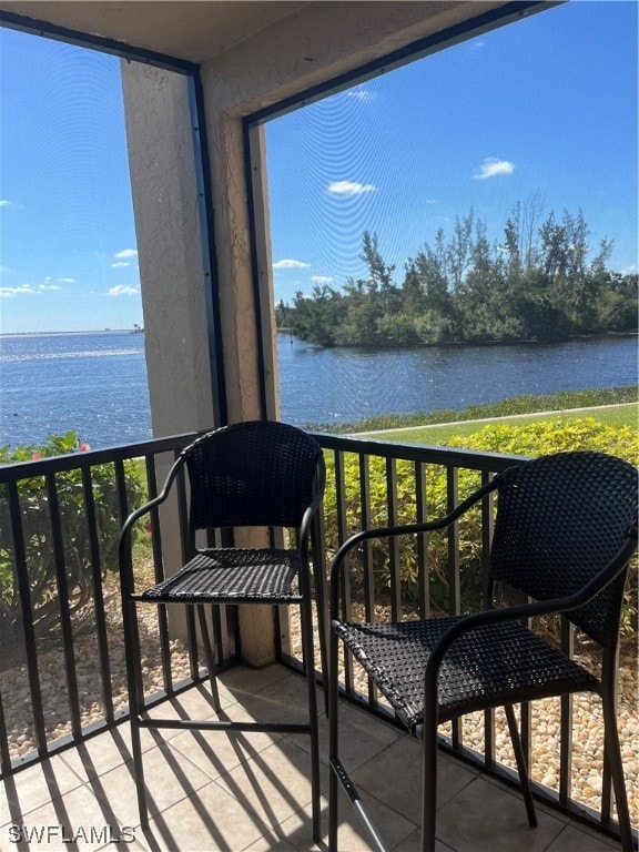 balcony featuring a water view