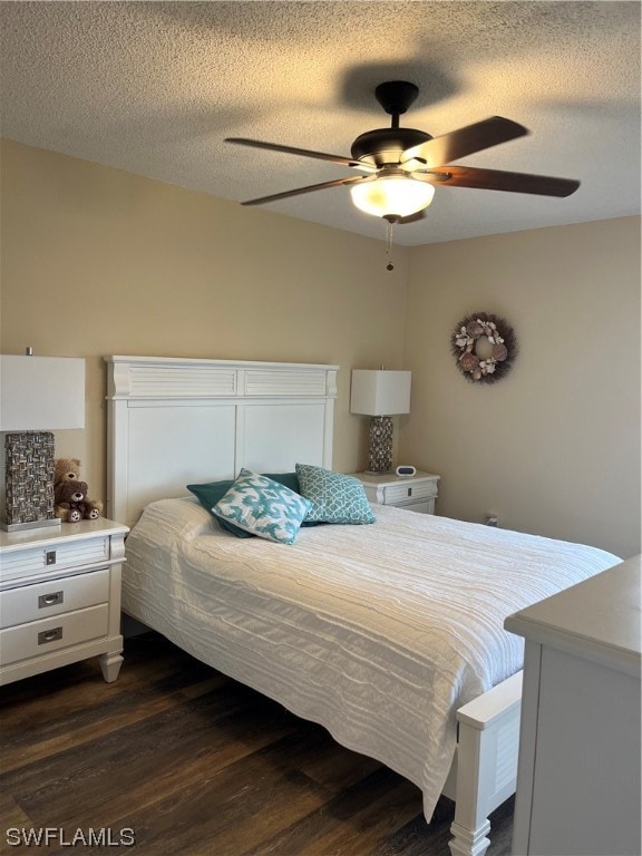 bedroom featuring a textured ceiling, ceiling fan, and dark hardwood / wood-style flooring