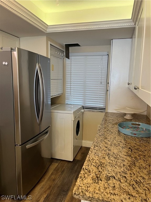 laundry room featuring washer / dryer and dark wood-type flooring