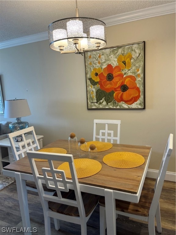 dining area with crown molding, a textured ceiling, and dark wood-type flooring