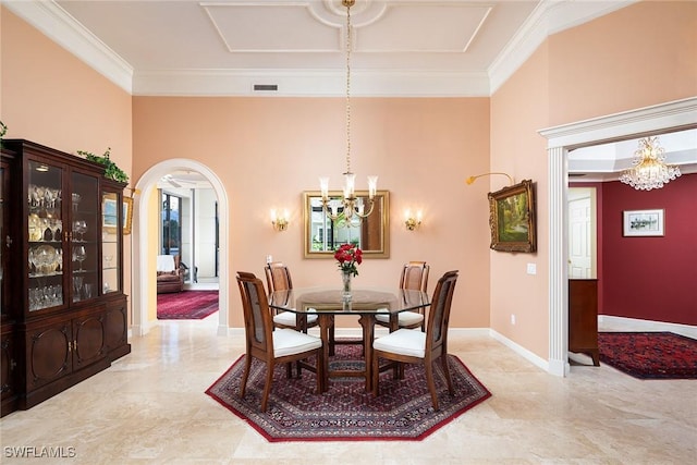 dining room with crown molding and a chandelier