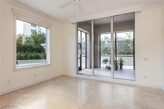 unfurnished room with ceiling fan and ornamental molding