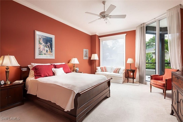 carpeted bedroom with ceiling fan and ornamental molding