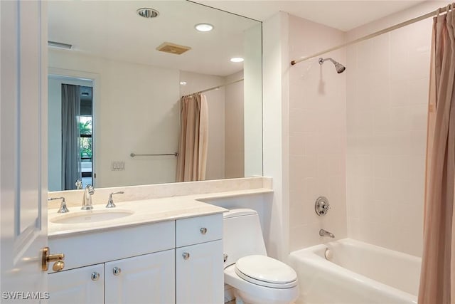 full bathroom with toilet, vanity, and shower / tub combo with curtain