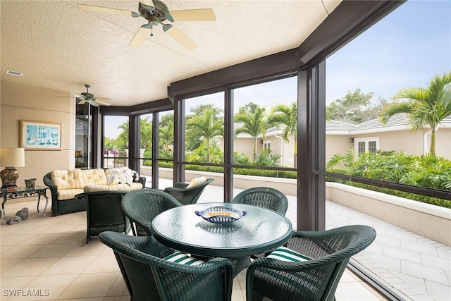 sunroom / solarium with ceiling fan and a wealth of natural light