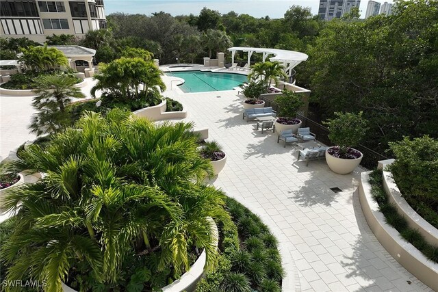 view of swimming pool with a patio