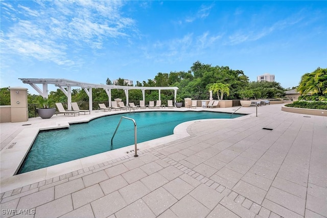 view of pool with a patio and a pergola