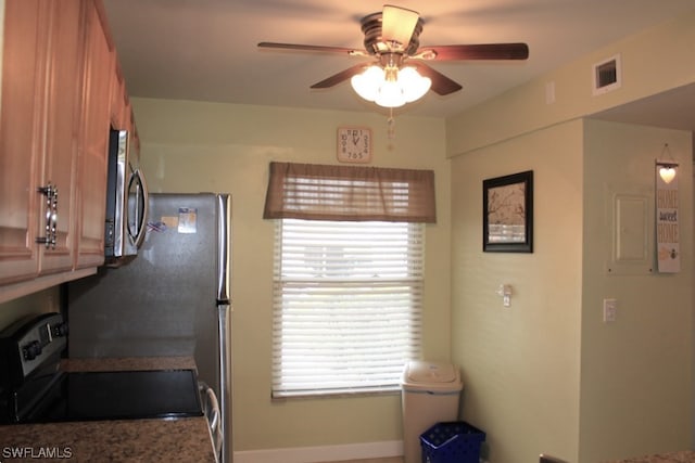 kitchen featuring ceiling fan and range with electric stovetop