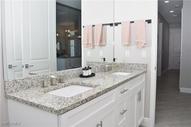 bathroom with vanity and hardwood / wood-style floors