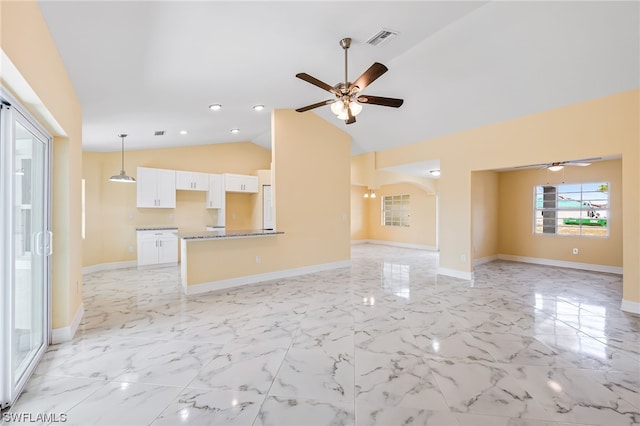 unfurnished living room featuring lofted ceiling, ceiling fan, and light tile floors