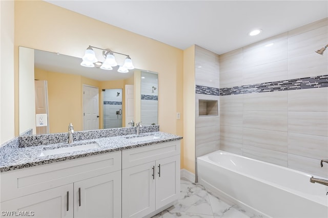 bathroom featuring double sink vanity, tile floors, and tiled shower / bath