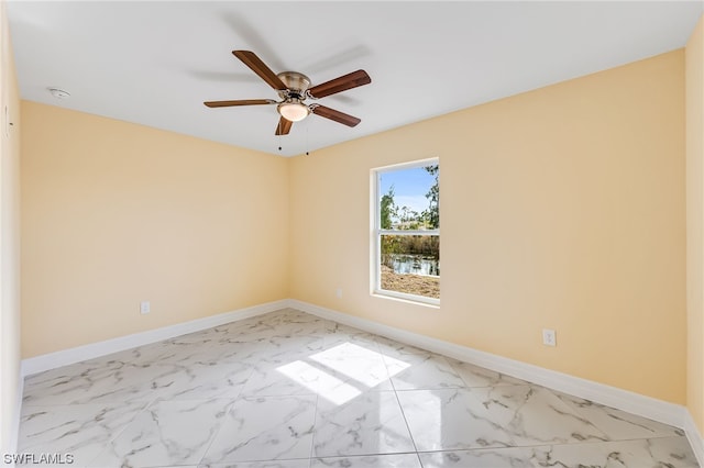 unfurnished room with light tile flooring and ceiling fan