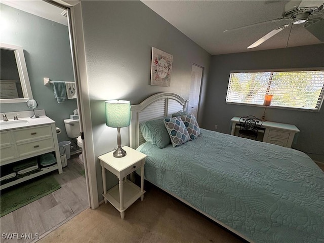 14861 Summerlin Woods Dr Unit 13, Fort Myers, FL 33919 - bedroom featuring ceiling fan, light wood-style floors, lofted ceiling, and a sink