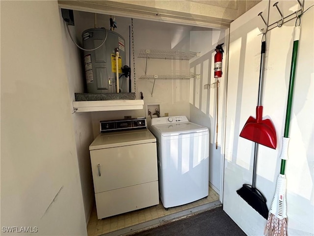 14861 Summerlin Woods Dr Unit 13, Fort Myers, FL 33919 - clothes washing area with water heater, plenty of natural light, laundry area, and washer and clothes dryer