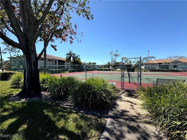 14861 Summerlin Woods Dr Unit 13, Fort Myers, FL 33919 - view of sport court with fence and a gate
