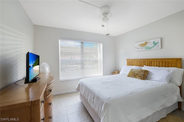 tiled bedroom with ceiling fan