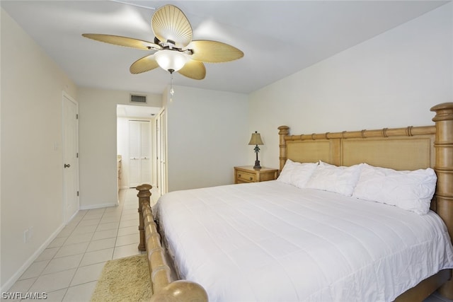 tiled bedroom with ceiling fan