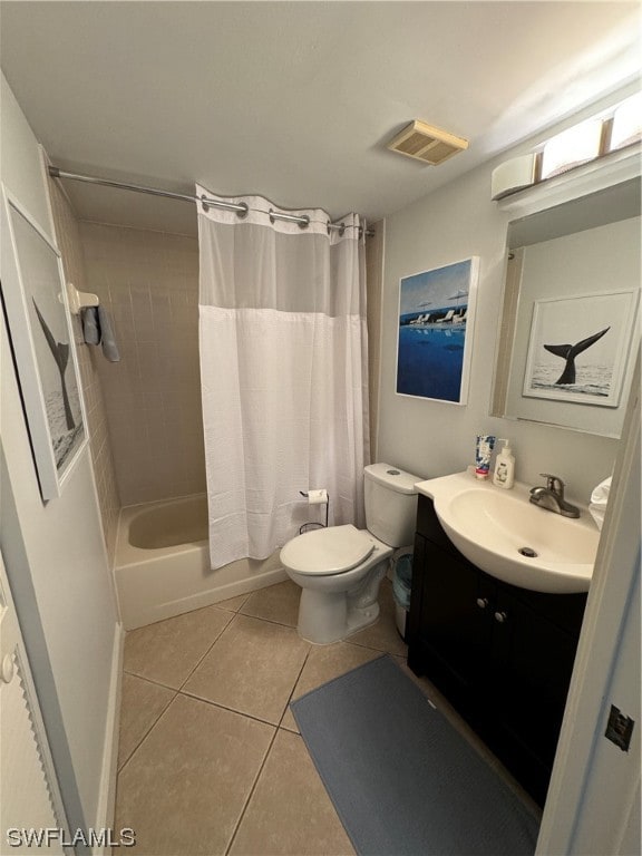 full bathroom with vanity, tile flooring, shower / bath combo with shower curtain, and toilet