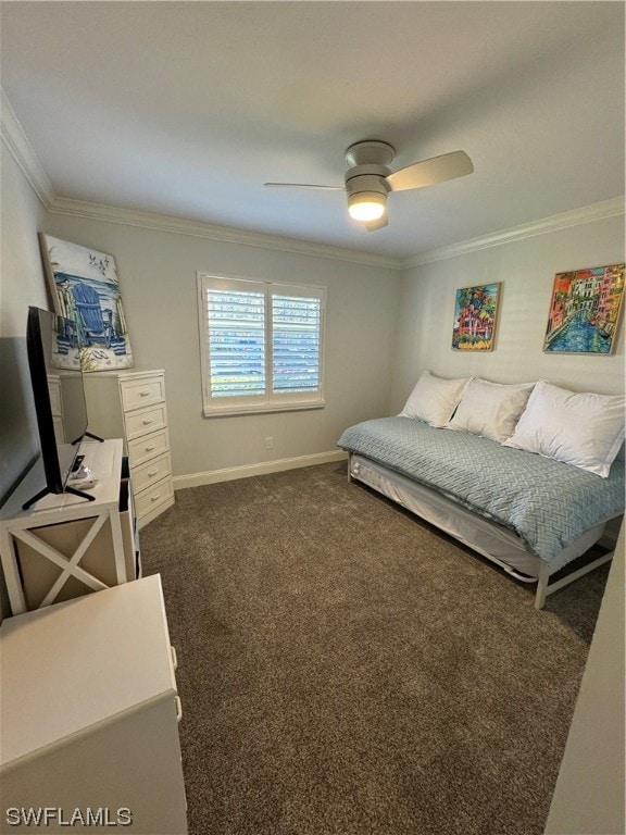 bedroom with dark colored carpet, crown molding, and ceiling fan