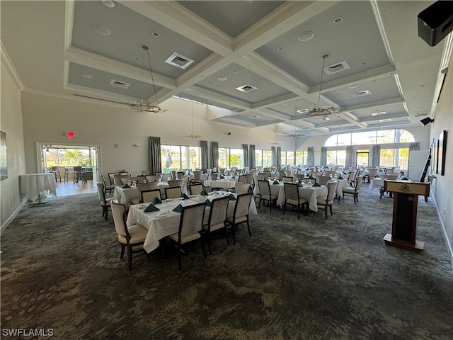 dining space featuring plenty of natural light, an inviting chandelier, coffered ceiling, and dark carpet