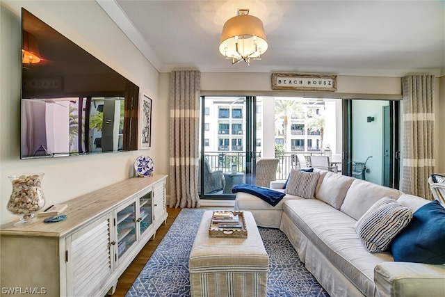 living room with a notable chandelier and dark hardwood / wood-style floors