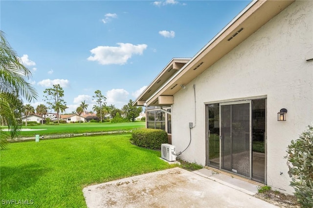 view of yard featuring ac unit, a patio, and a lanai